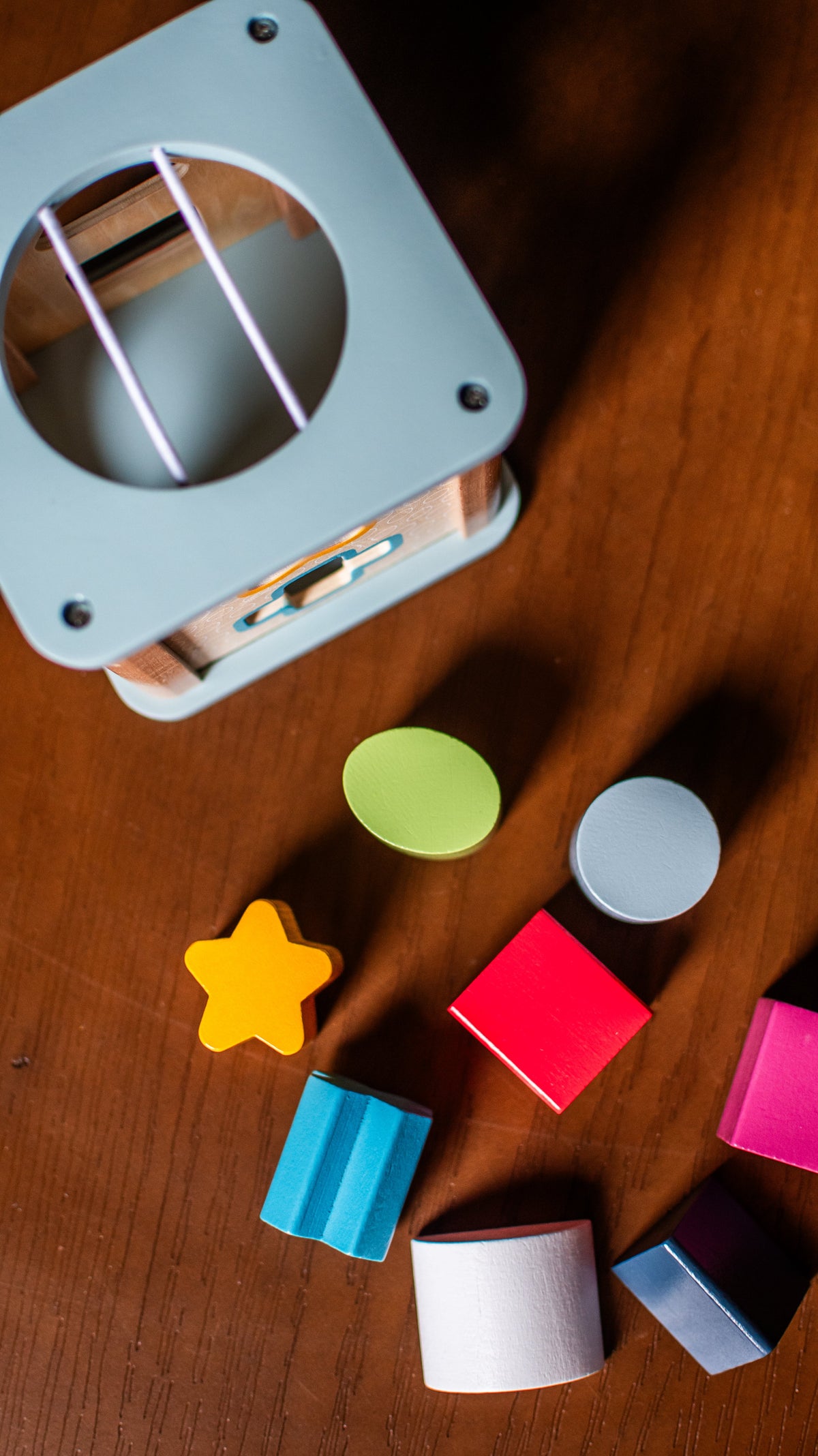 Wooden shape sorter included in Luminara Fine-Motor Learning Duo
